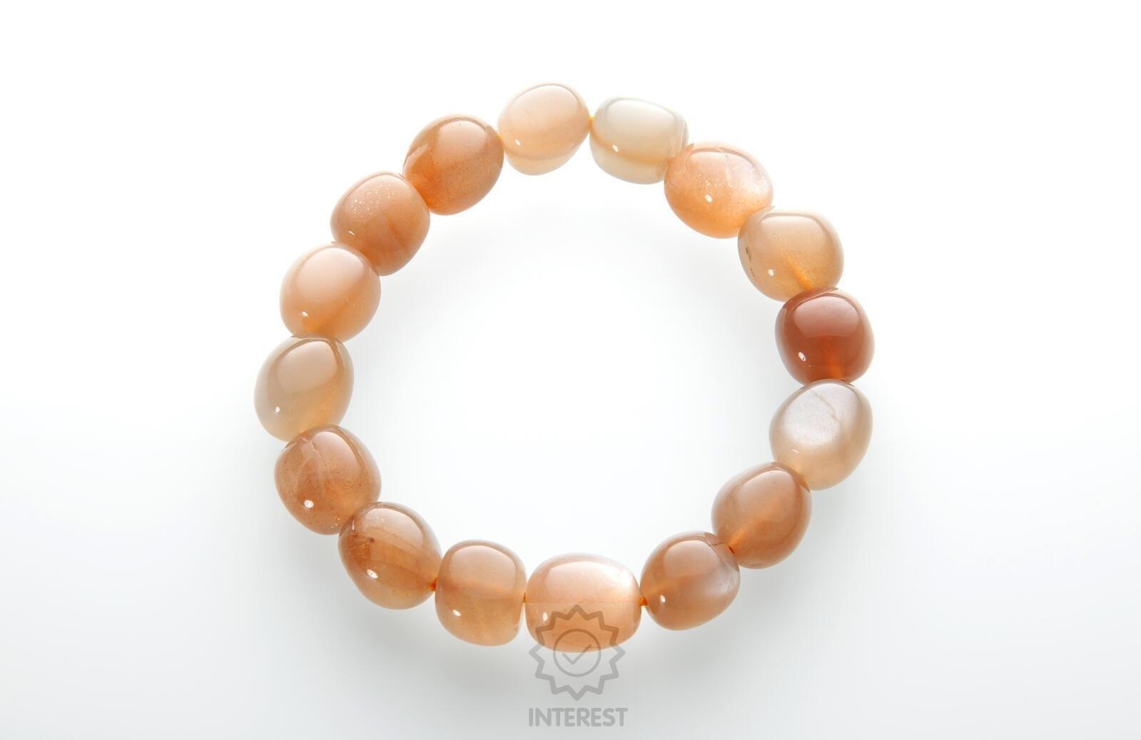 Náramek - Měsíční kámen oranžový troml 10 - 12 mm.